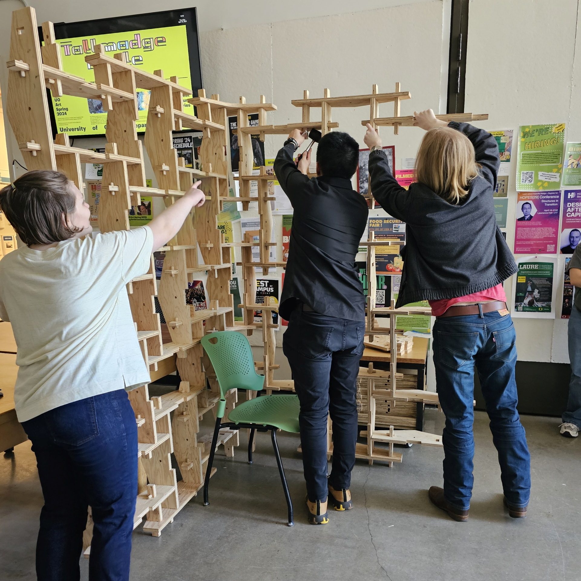 Students build a wall with the  arch pavilion pieces and new components.